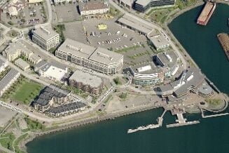 Contemporary commercial buildings with a sleek design and ample parking space in Jutland