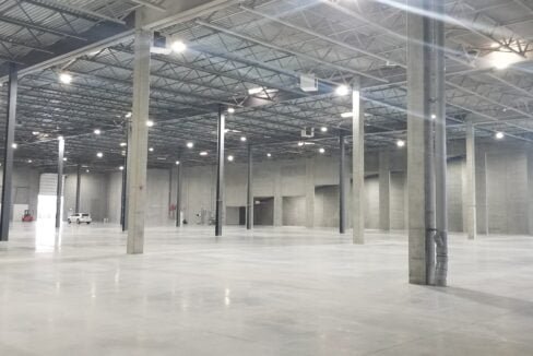 a large empty warehouse with persony pillars